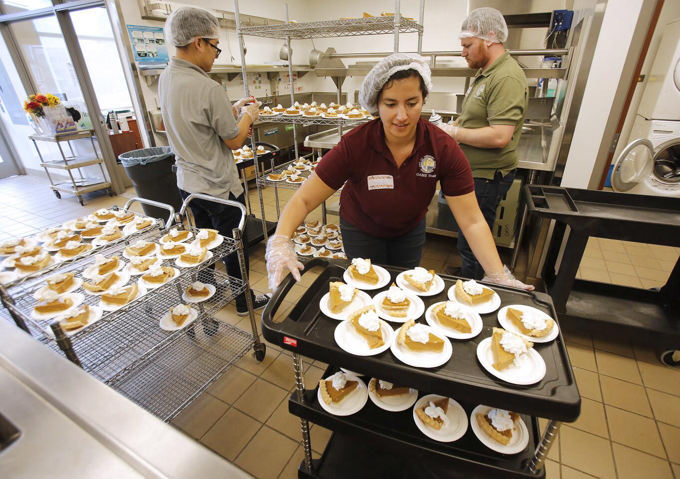 Pumpkin pie is rolled out by staff members of the Newport Beach Recreation & Senior Services Department and the Oasis Senior Center during a Thanksgiving luncheon Wednesday at the center in Corona del Mar.