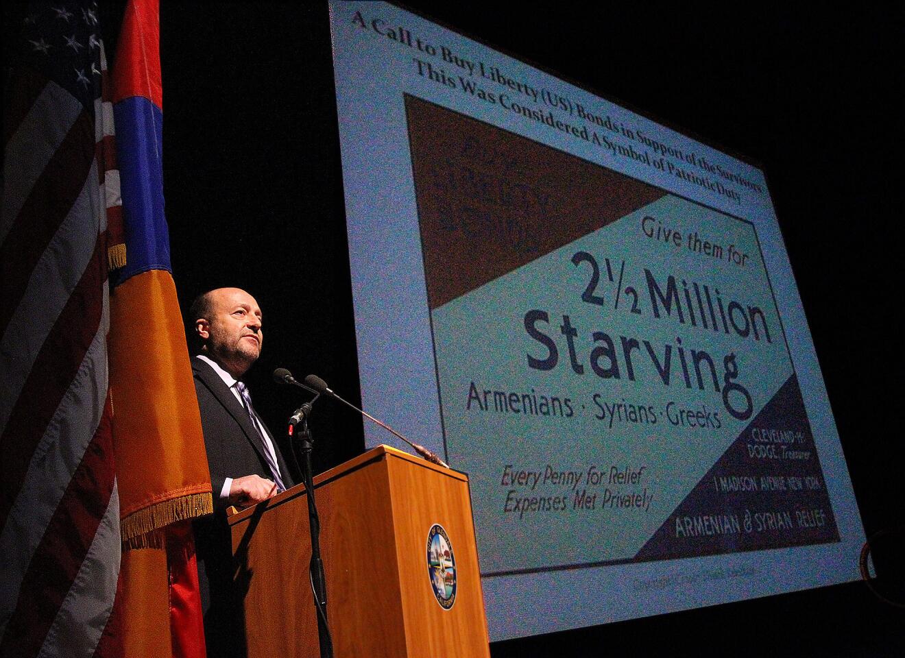 Speaker Maurice Missak Kelechian demonstrates the American involvement in the relief efforts to the plight of the Armenians during the time of the genocide at the City of Glendale's 13th Annual Commemoration of the Armenian Genocide at the Alex Theatre in Glendale on Thursday, April 24, 2014.