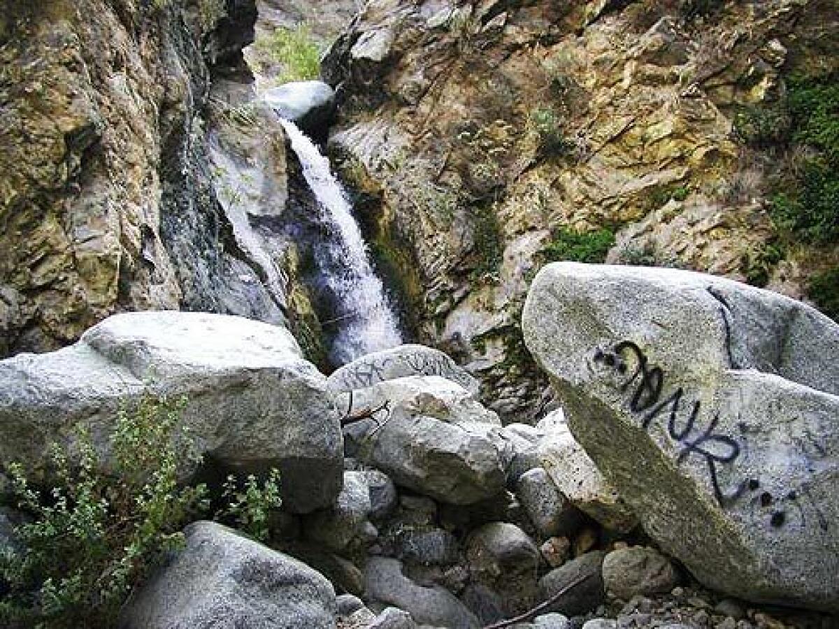 Graffiti mars a popular cascade at Eaton Canyon Natural Area in the San Gabriel Mountains.