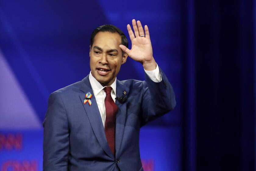 Former Housing and Urban Development Secretary and Democratic presidential candidate Julian Castro waves as he takes the stage during the Power of our Pride Town Hall Thursday, Oct. 10, 2019, in Los Angeles. The LGBTQ-focused town hall featured nine 2020 Democratic presidential candidates. (AP Photo/Marcio Jose Sanchez)