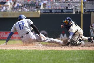 Los Angeles Dodgers designated hitter Shohei Ohtani (17) is tagged out at home plate by Minnesota Twins catcher Christian Vázquez to end the top of the seventh inning of a baseball game Wednesday, April 10, 2024, in Minneapolis. (AP Photo/Abbie Parr)
