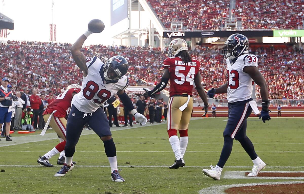 Texans tight end Stephen Anderson (89) celebrates after scoring a touchdown as Akeem Hunt (33) looks on during the second half.