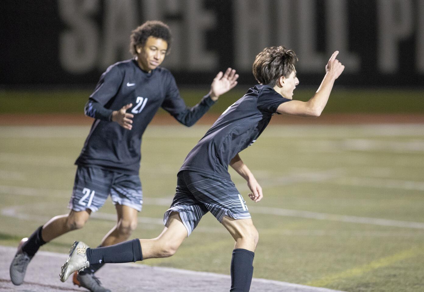 Sage Hill School's Omeed Abedi, right, celebrates after scoring a goal in the second half of Tuesday's CIF Southern Section Division 6 wild-card playoff match at home against Long Beach St. Anthony.