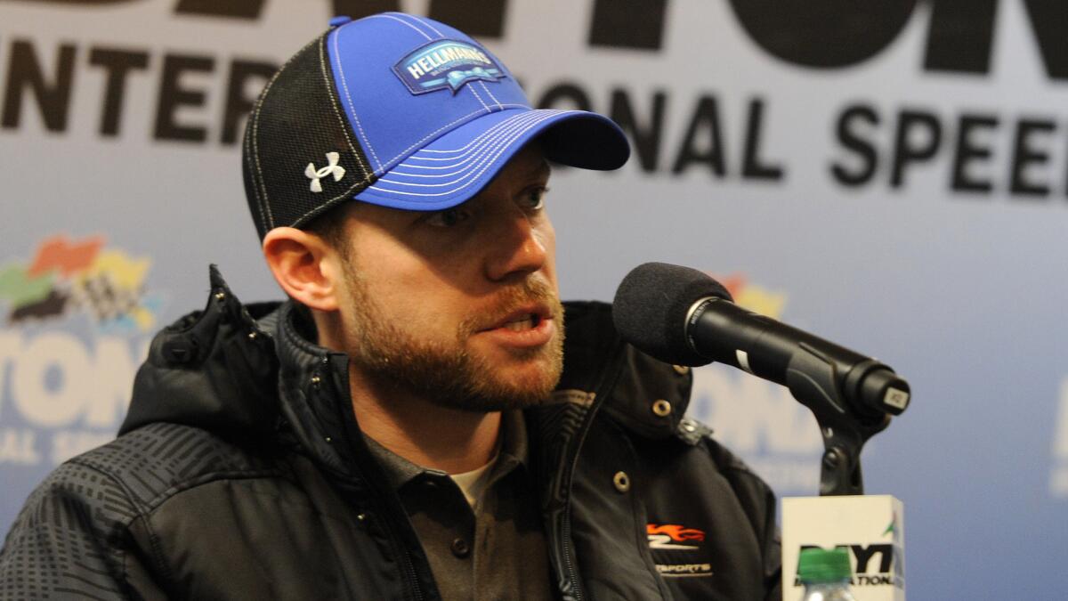NASCAR driver Regan Smith speaks at a news conference Feb. 21 at Daytona International Speedway.