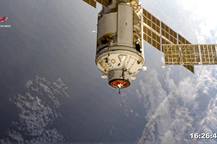 In this photo provided by Roscosmos Space Agency Press Service, the Nauka module is seen prior to docking with the International Space Station on Thursday, July 29, 2021. Russia's long-delayed lab module successfully docked with the International Space Station on Thursday, eight days after it was launched from the Russian space launch facility in Baikonur, Kazakhstan. The 20-metric-ton (22-ton) Nauka module, also called the Multipurpose Laboratory Module, docked with the orbiting outpost after a long journey and a series of manoeuvres. (Roscosmos Space Agency Press Service photo via AP)