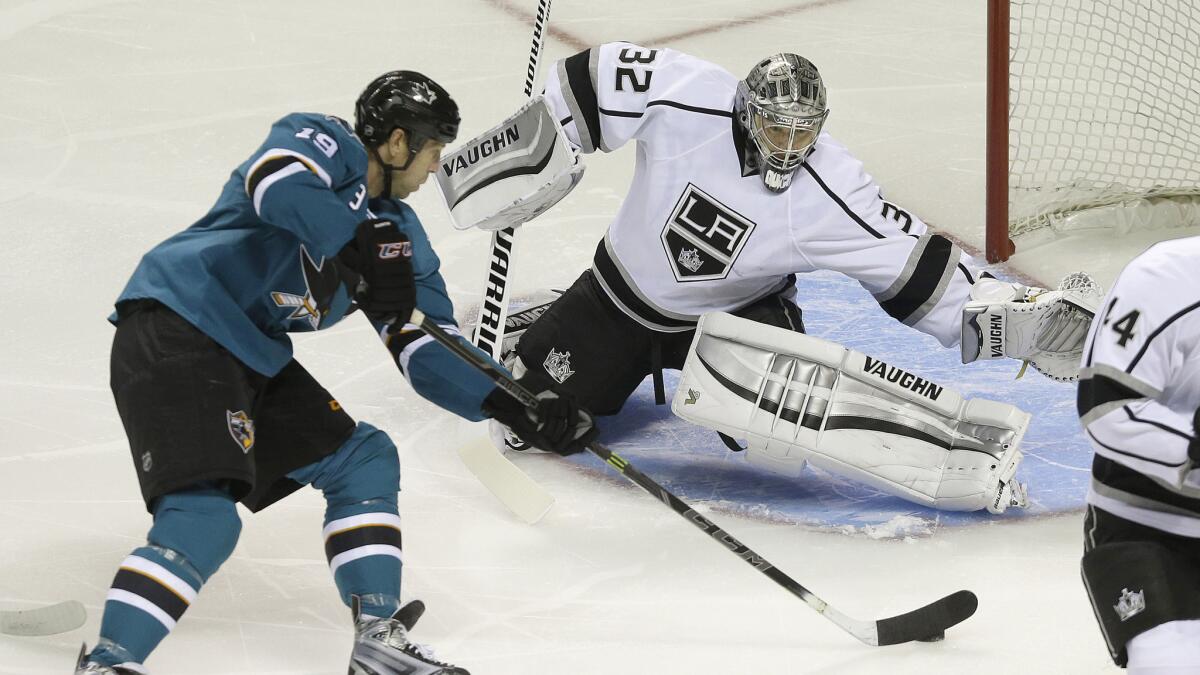 San Jose Sharks center Joe Thornton, left, scores against Kings goalie Jonathan Quick during an exhibition game Tuesday. The Sharks and Kings figure to be among the elite teams in the Western Conference this season.