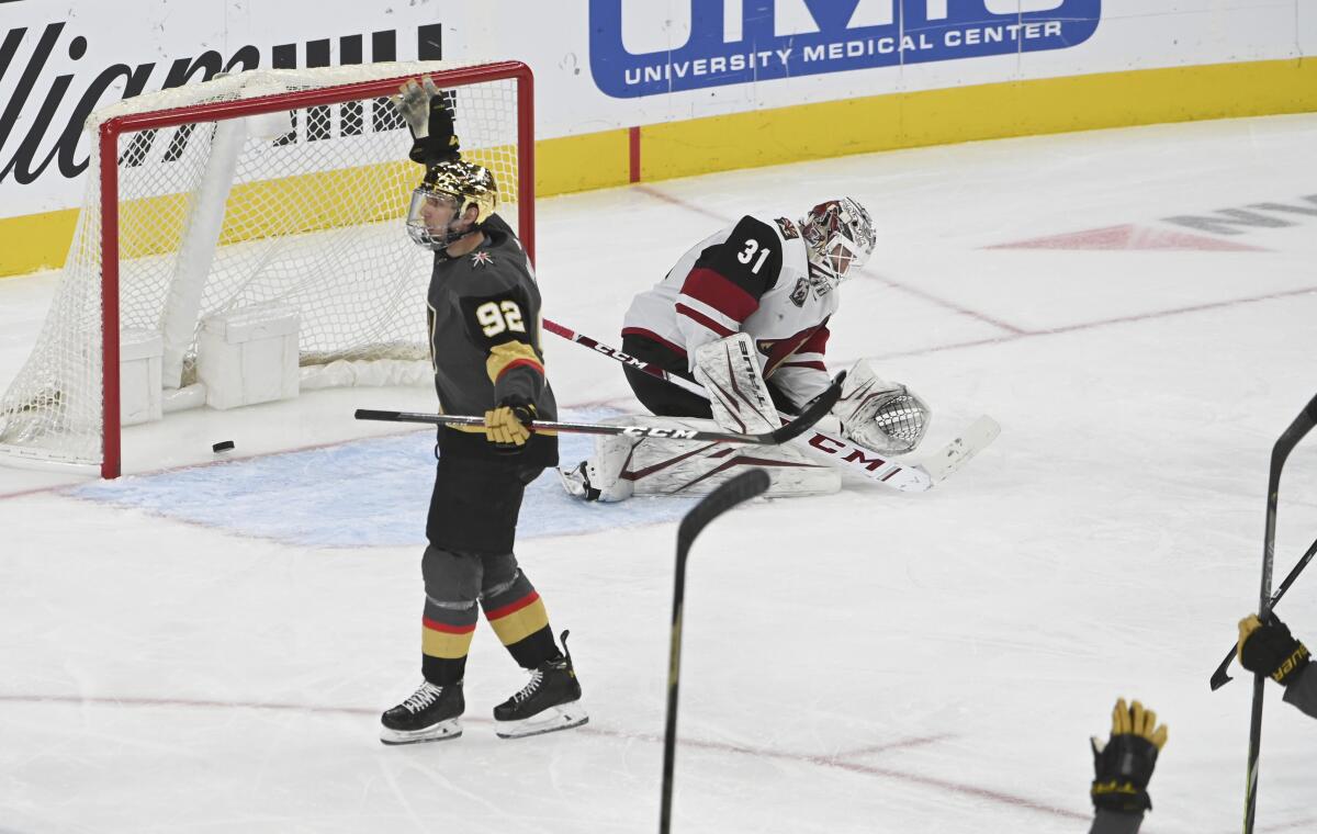 Vegas Golden Knights left wing Tomas Nosek (92) reacts after scoring against Arizona Coyotes goaltender Adin Hill (31) during the third period of an NHL hockey game Sunday, April 11, 2021, in Las Vegas. (AP Photo/David Becker)