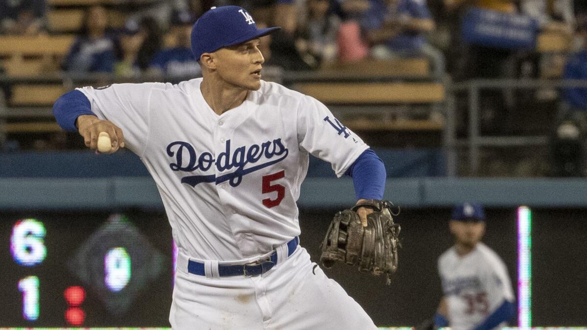 Corey Seager throws to first base during game against the Arizona Diamondbacks at Dodger Stadium on March 29.