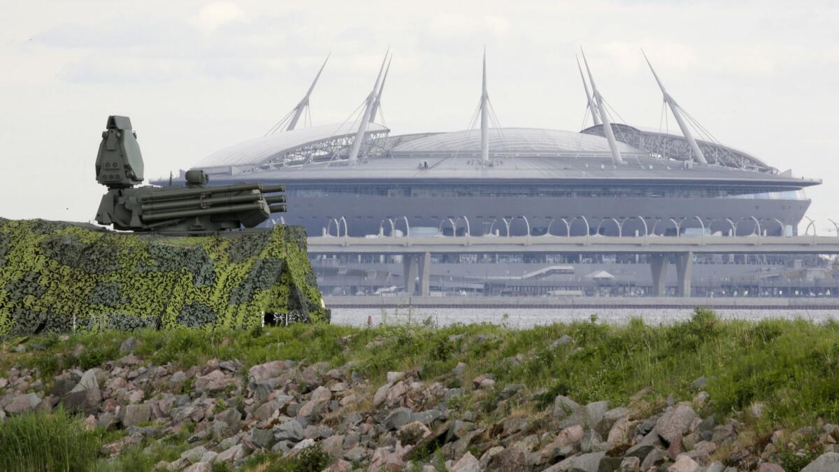 A Pantsir antiaircraft missile unit, left, is set up within sight of Saint Petersburg stadium, a World Cup venue.