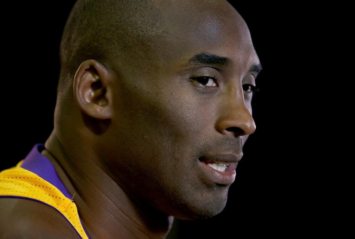 Kobe Bryant answers questions during the Lakers' media day at the team's training facility in El Segundo on Saturday.