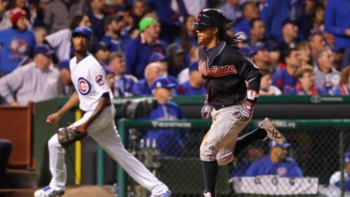 Infielder Michael Martinez scores on a single by outfielder Coco Crisp to give the Indians a 1-0 lead over the Cubs in Game 3 of the World Series on Oct. 28.