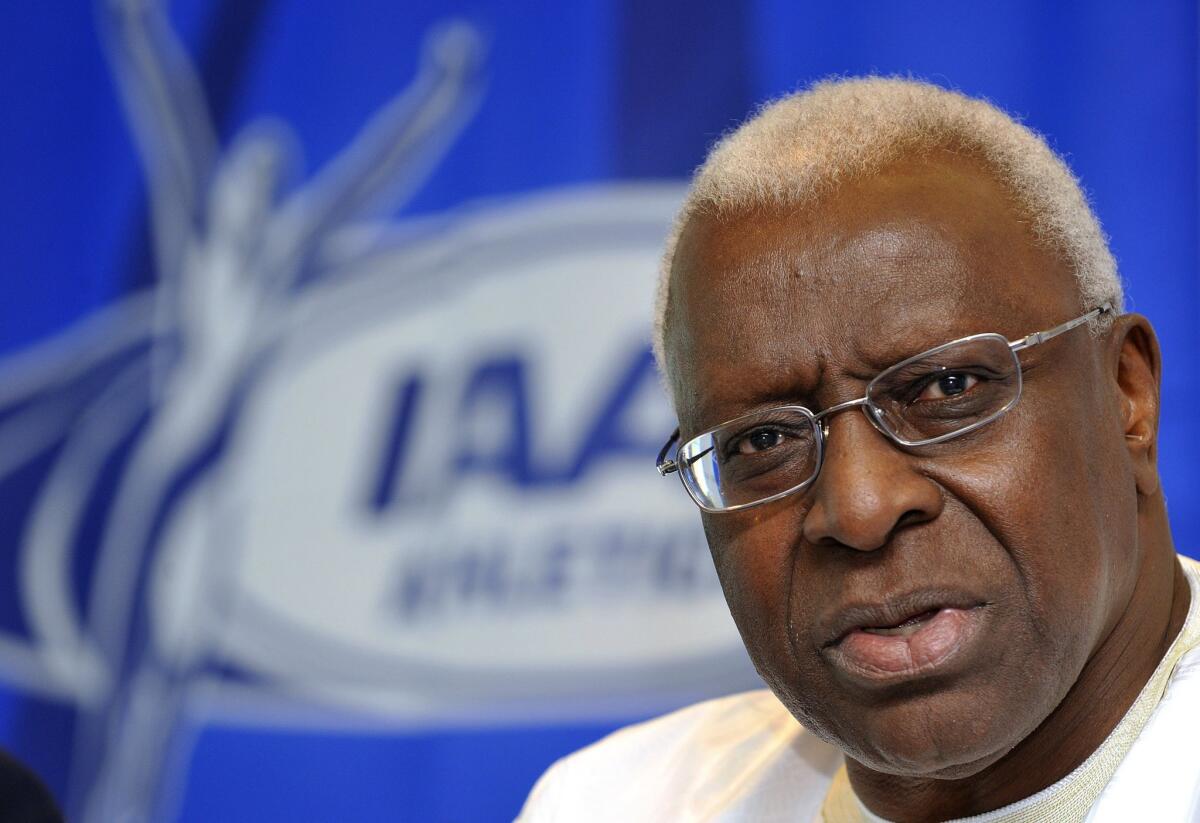 International Olympic Committee officials have provisionally suspended the honorary membership of Lamine Diack, a former president of the international track federation. Diack, shown in 2009, is under criminal investigation for taking bribes to suppress positive results for doping.