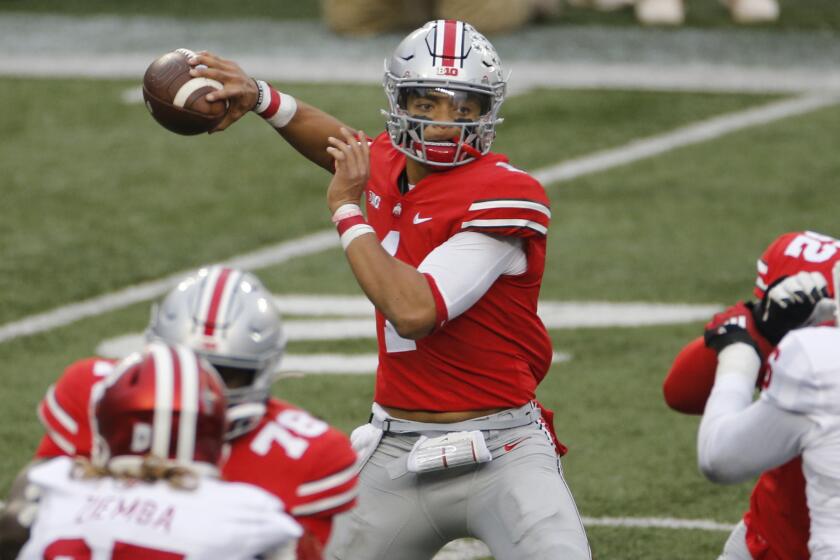 Ohio State quarterback Justin Fields throws a pass against Indiana during the first half.