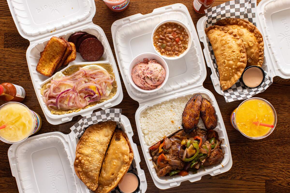 Four Styrofoam containers of Dominican food from El Bacano in North Hollywood