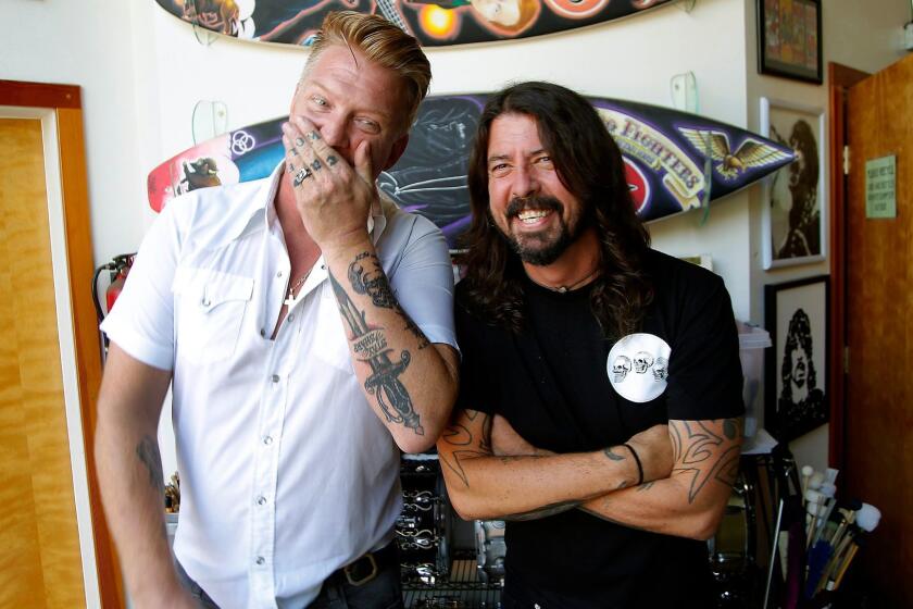NORTHRIDGE, CA.,SEPTEMBER 1, 2017-- (l to r) Josh Homme (of Queens of the Stone Age) and Dave Grohl (of Foo Fighters) at the Foo Fighters' studio in the Valley for a story about both bands' new albums and Cal Jam, a one-day rock festival in San Bernardino in October that will feature the groups. (kirk McKoy /Los Angels Times)
