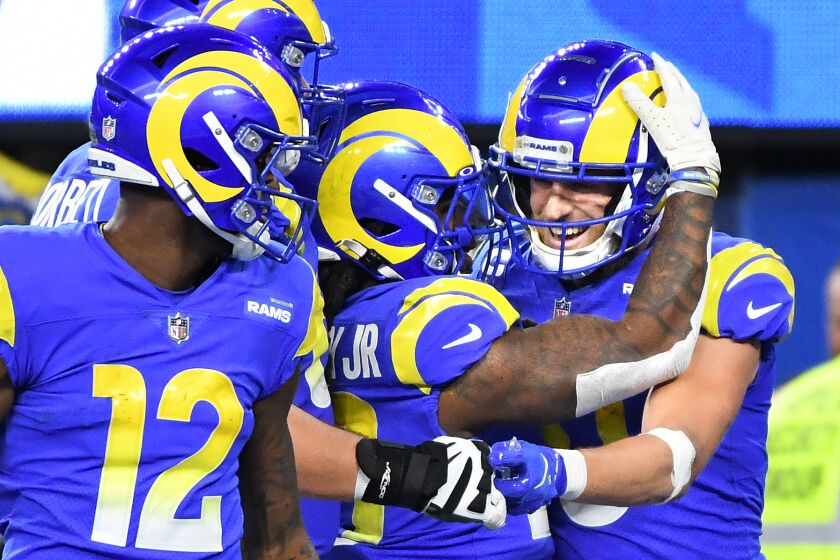 Inglewood, California December 21, 2021: Rams receiver Cooper Kupp, right, celebrates with teammates.