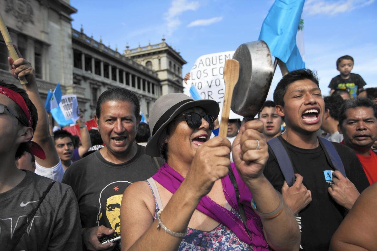 Protesters rally in August outside Guatemala's National Palace to demand the resignation of President Otto Perez Molina. An election to replace him is Sunday.