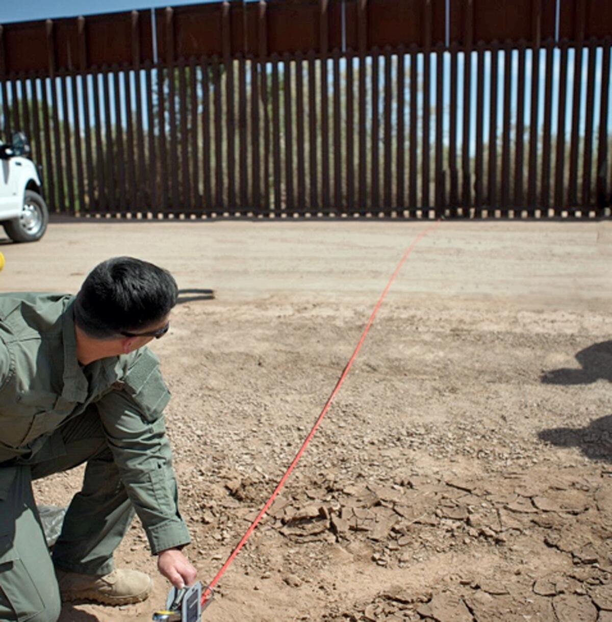 A Border Patrol agent shows the path of a tunnel that crosses the U.S.-Mexico border near Calexico. The passage extends about 60 feet into Mexico and at least 80 feet into the United States. (Associated Press)