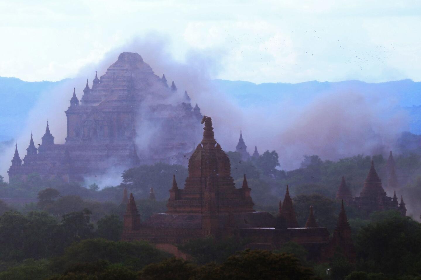 The ancient Dhammayangyi temple is seen shrouded in dust as a 6.8 magnitude earthquake hit Bagan on August 24, 2016.