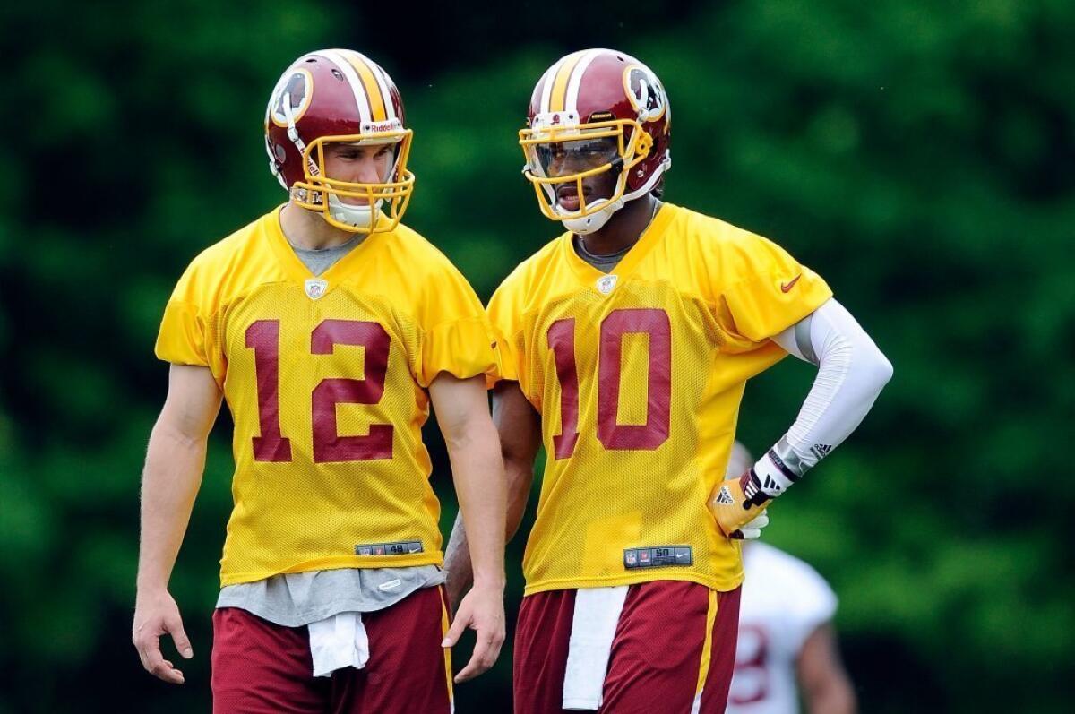 Kirk Cousins, left, will replace Robert Griffin III as quarterback for the Redskins the rest of the season.