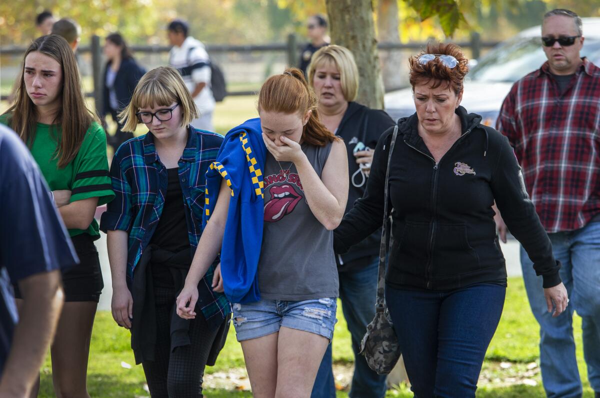 Students and family members leave Central Park in Santa Clarita