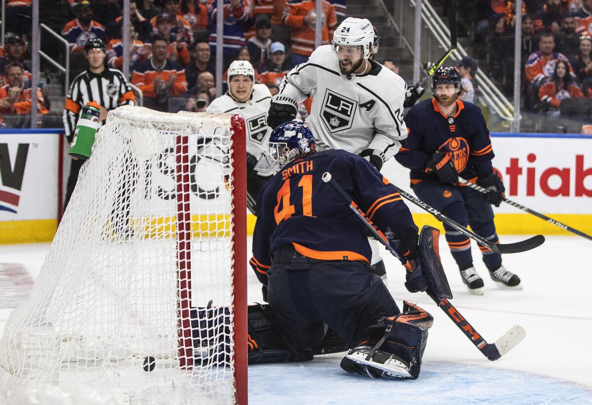 Kings center Phillip Danault (24) scores in the third period against Oilers goalie Mike Smith in Game 1 on Monday.
