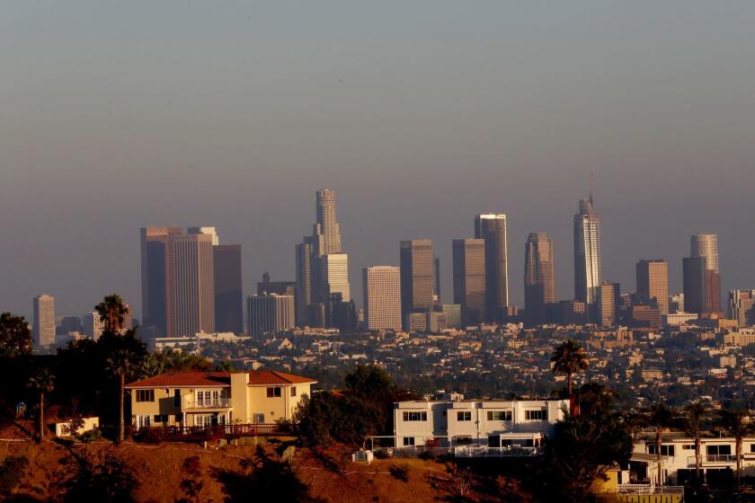 LOS ANGELES, CA - AUGUST 10, 2016: Photograph from near the Griffith Park Observatory looking toward down town Los Angeles in the background August 10, 2016. Southern California is experiencing its worst smog in years this summer as heat and stagnant weather increase the number of bad air days and drive up ozone pollution to levels not seen since 2009. Where pollution is worst, in the Inland Empire, hospitals and asthma clinics are reporting increases in patients seeking treatment for respiratory illness, their breathing difficulties exacerbated by the persistent heat and pollution. (Francine Orr/ Los Angeles Times)