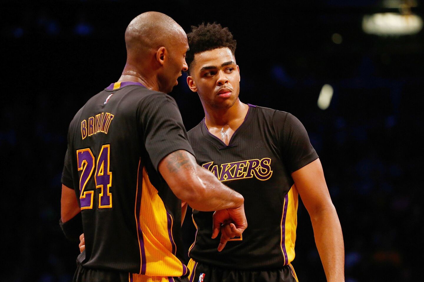 Los Angeles Lakers' Kobe Bryant (24) and D'Angelo Russell (1) talk during the game against the Brooklyn Nets on Friday.