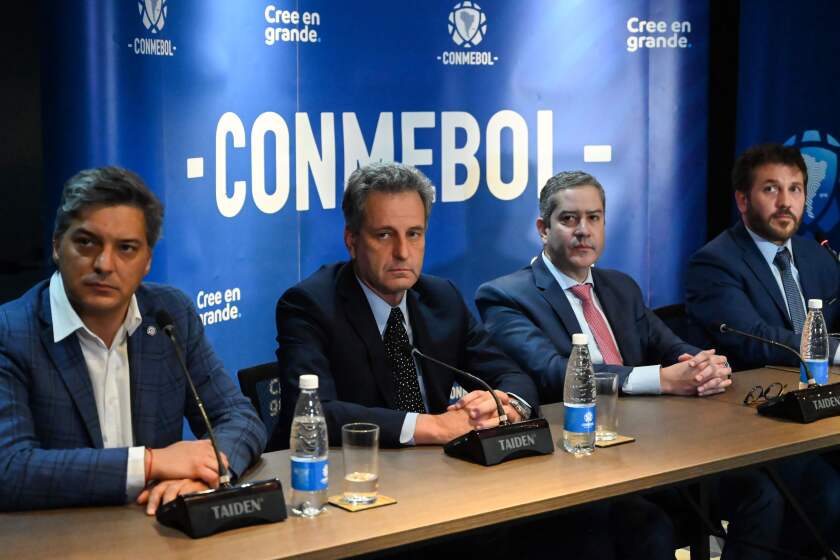 Chilean President of the ANFP Sebastian Moreno (L), Flamengo's President Rodolfo Landim (2nd L), Brazilian Football Confederation (CBF) President Rogerio Caboclo (2nd R), CONMEBOL's President Alejandro Dominguez (R) take part in a press conference announcing the location of the Libertadores Cup final next November 23 in Lima, Peru, at the headquarters of the South American Football Confederation (Conmebol), on November 5, 2019 in Luque, Paraguay. (Photo by NORBERTO DUARTE / AFP) (Photo by NORBERTO DUARTE/AFP via Getty Images) ** OUTS - ELSENT, FPG, CM - OUTS * NM, PH, VA if sourced by CT, LA or MoD **