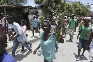 People march to demand the freedom of New Hampshire nurse Alix Dorsainvil and her daughter, who have been reported kidnapped, in the Cite Soleil neighborhood of Port-au-Prince, Haiti, Monday, July 31, 2023. Dorsainvil works for the El Roi Haiti nonprofit organization and the U.S. State Department issued a "do not travel advisory" ordering nonemergency personnel to leave the Caribbean nation amid growing security concerns. (AP Photo/Odelyn Joseph)