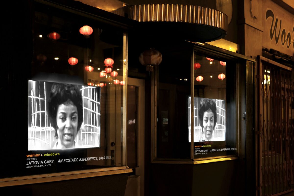 Video artist Ja'Tovia Gary's "An Ecstatic Experience" plays in a Chung King Road storefront.
