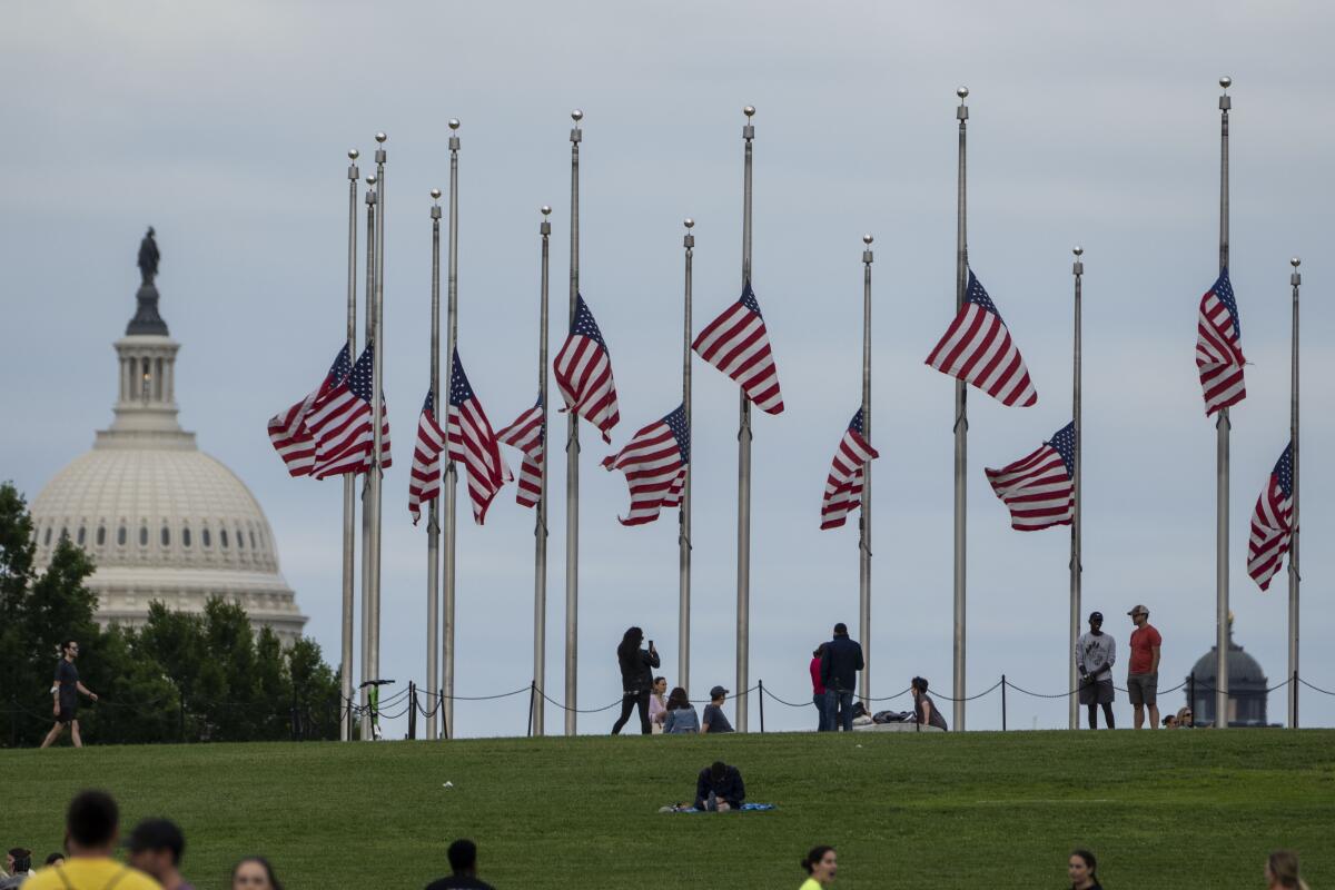 Flags are flown at half-staff for the victims of a deadly shooting at a Texas elementary school.