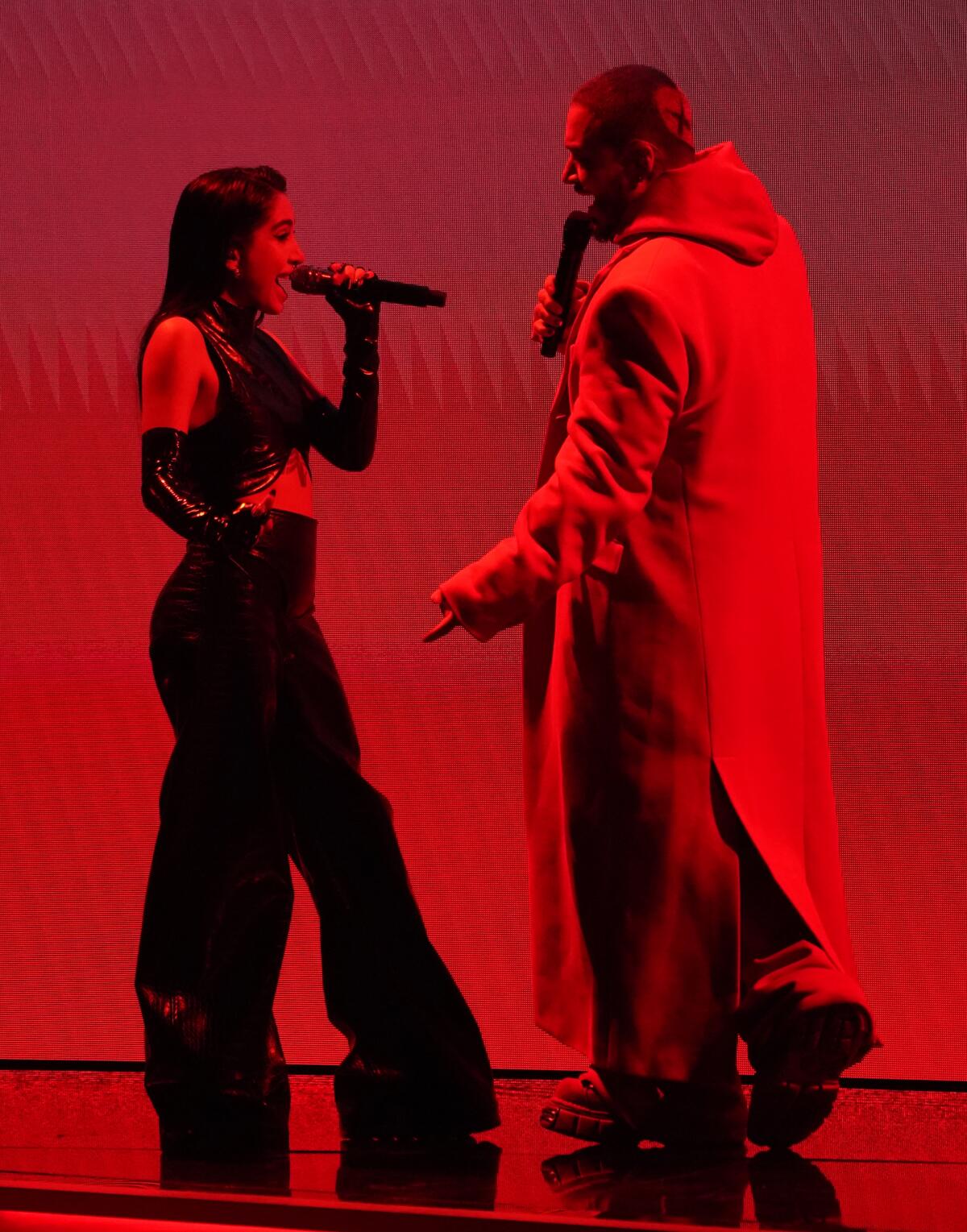 Maria Becerra, left, and J Balvin perform a medley at the 64th Grammy Awards.