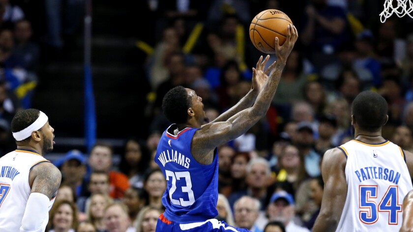 Clippers guard Lou Williams beats the Thunder defense for a layup on Friday night.