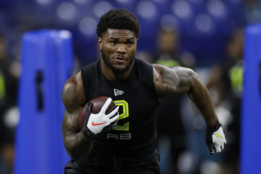 Florida State running back Cam Akers runs a drill at the NFL football scouting combine in Indianapolis.