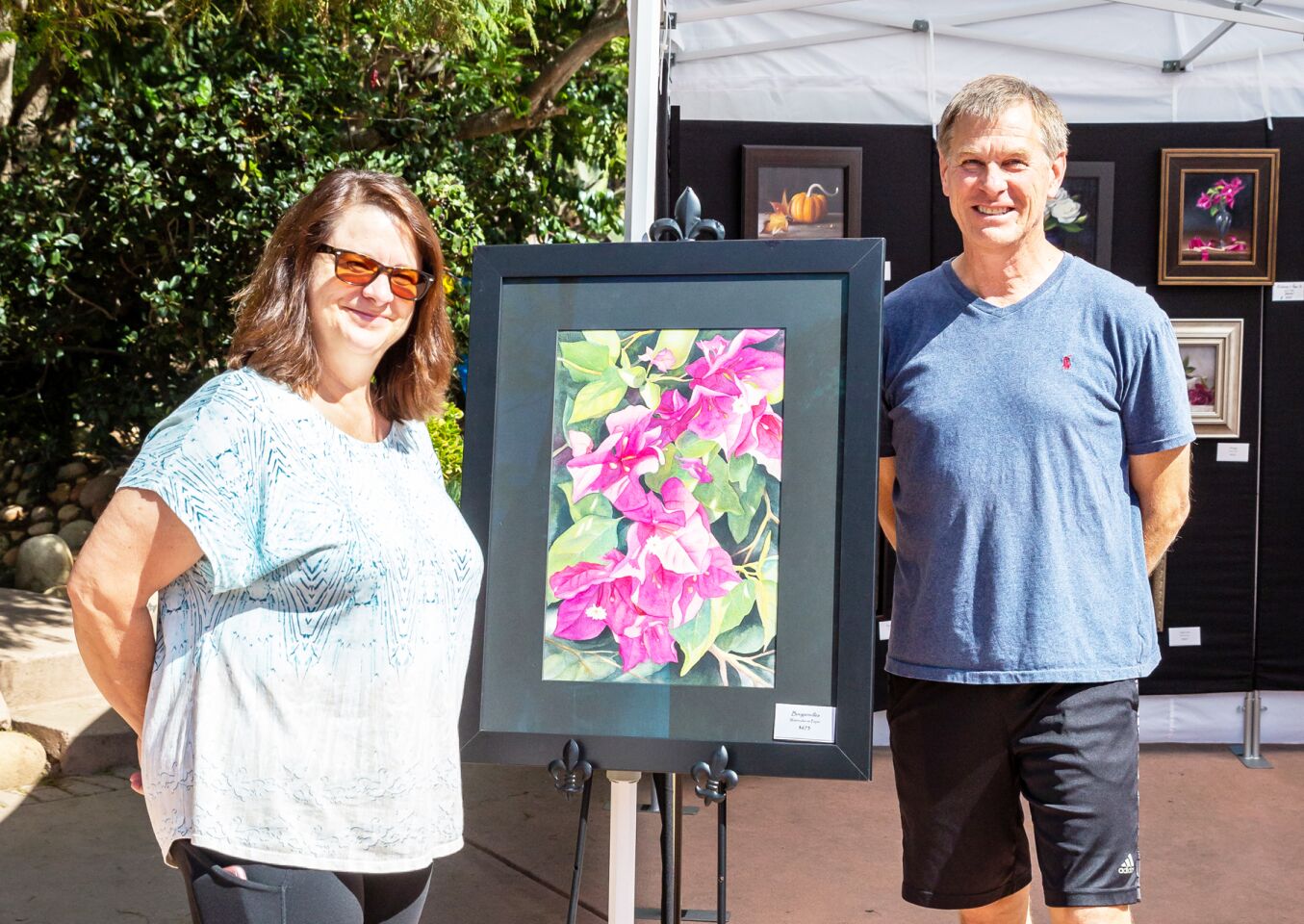 Jim and Tara Hartke with artwork by Sherry Roper.