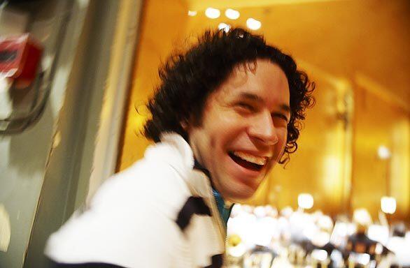 Gustavo Dudamel enjoys a light moment during a short fine-tuning session with the Swedish Gothenburg Symphony on May 29, 2009, just before the evening performance.