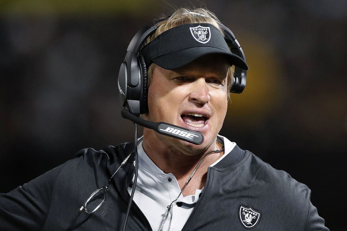 FILE - In this Aug. 10, 2018, file photo, Oakland Raiders coach Jon Gruden reacts during the first half of an NFL preseason football game against the Detroit Lions in Oakland, Calif. Current or former players, along with people in positions of leadership with NFL clubs, have offered differing opinions this week on how pervasive the sorts of racist, homophobic and misogynistic thoughts expressed by Jon Gruden -- in emails he wrote from 2011-18, when he was an ESPN analyst between coaching jobs, to then-Washington club executive Bruce Allen – remain around the sport to this day. (AP Photo/John Hefti, File)