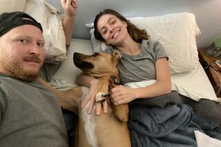 Katie McNight, her husband Nate Kauffman, and their dog Bernie after her first egg retrieval in 2020.