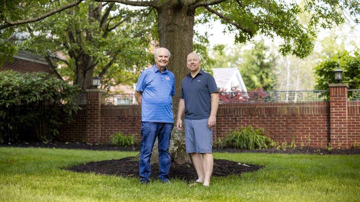 Hep Cronin, left, stands with his son, UCLA basketball coach Mick Cronin at Mick's home in Cincinnati, Tuesday, May 28, 2019.