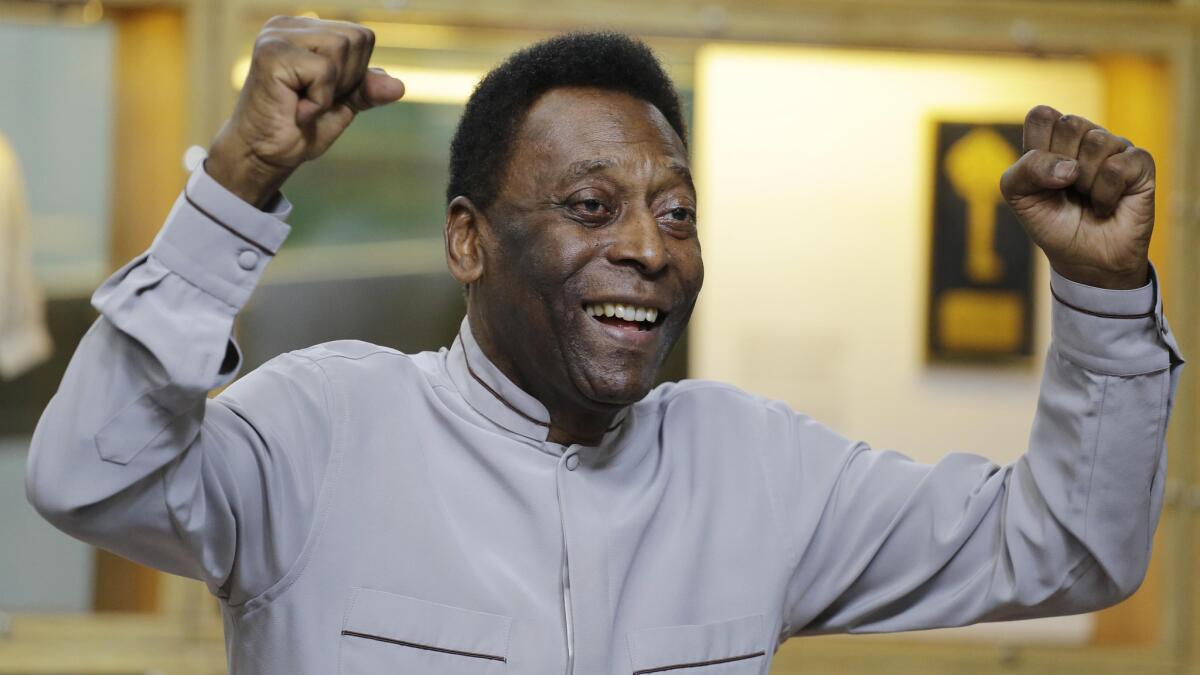 Brazilian soccer great Pele gestures during the inauguration of the Pele Museum in Santos, Brazil, on June 15.