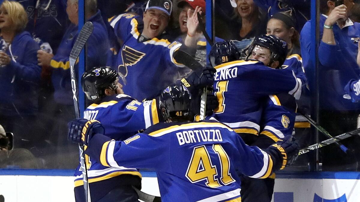Blues players celebrate after right wing Vladimir Tarasenko scored what proved to be the winning goal against the Predators on Friday night.