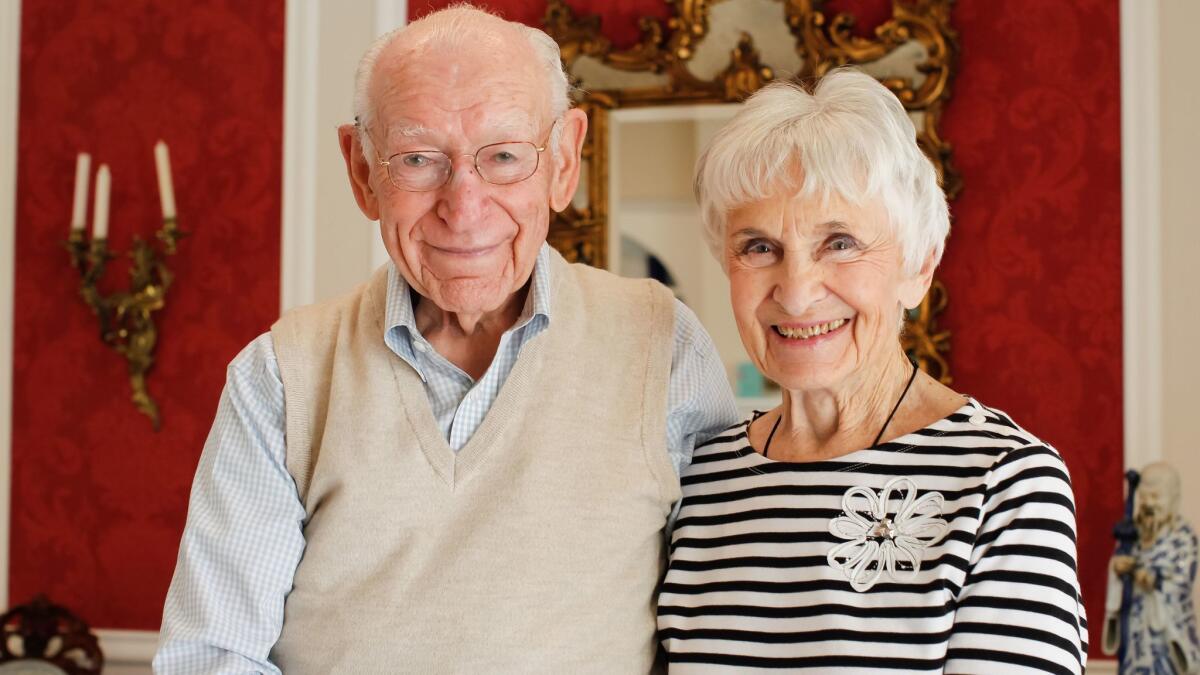 Blaine Briggs and his wife of 70 years, LaVerne, pose for photos at their home in Carlsbad, California.