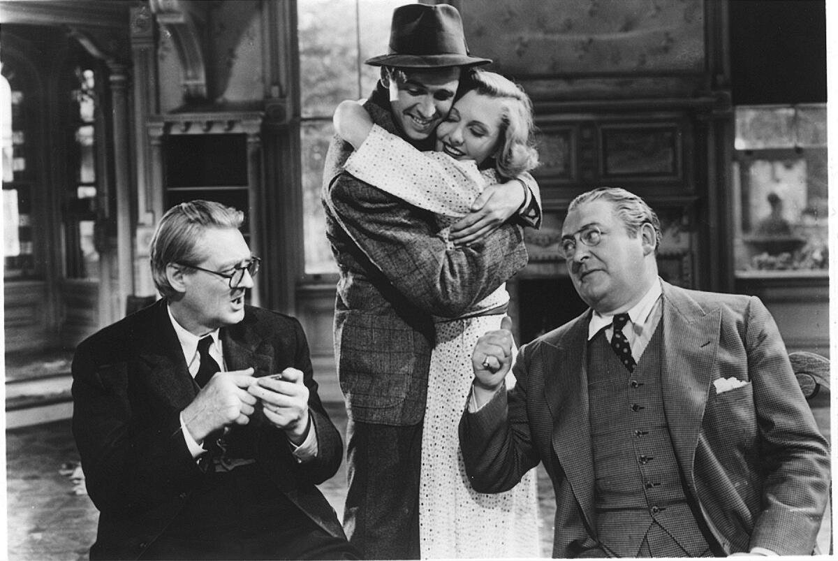 Lionel Barrymore, left, James Stewart, Jean Arthur and Edward Arnold in "You Can't Take It With You" (1938)