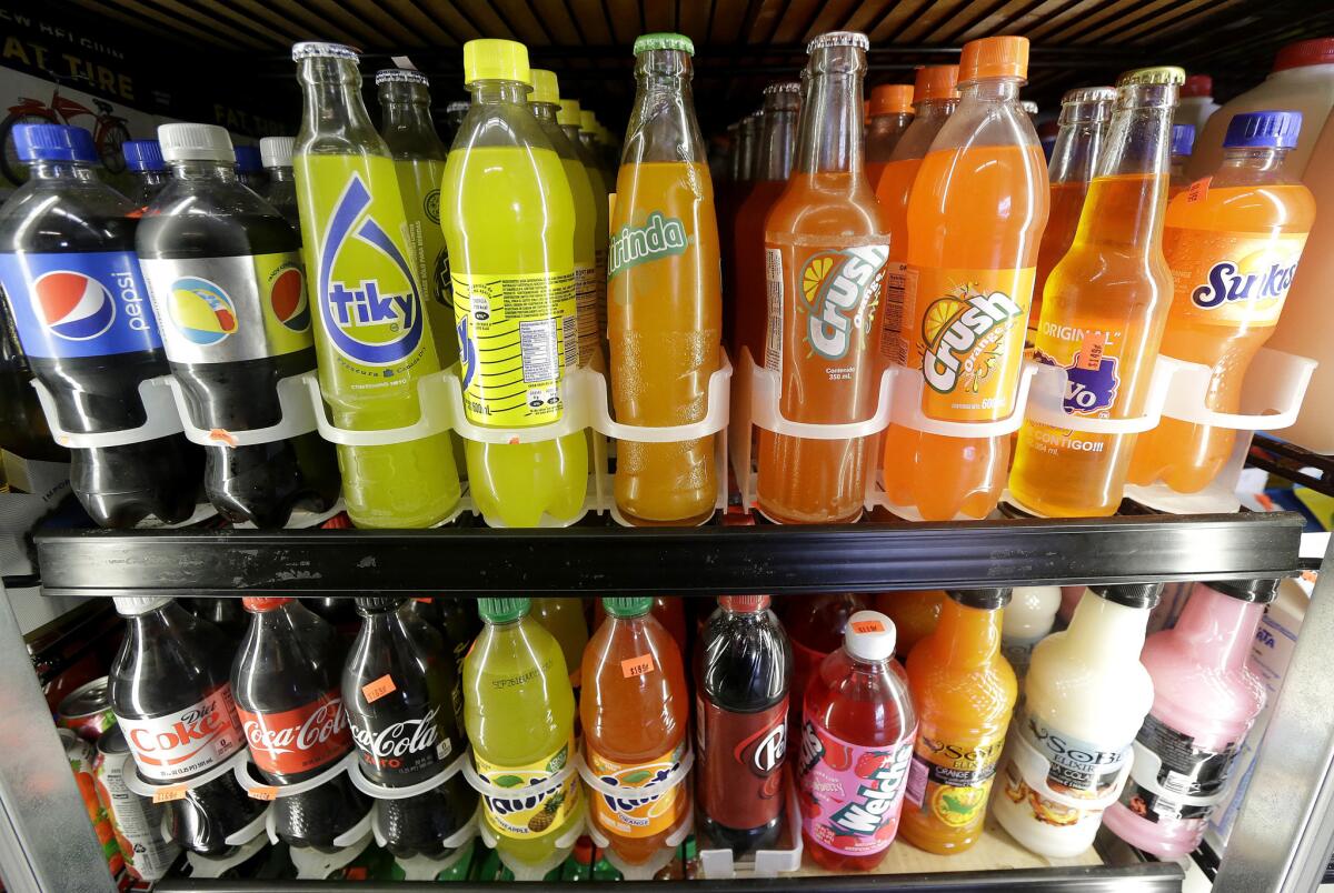 Soft drinks fill a refrigerator at a market in San Francisco.