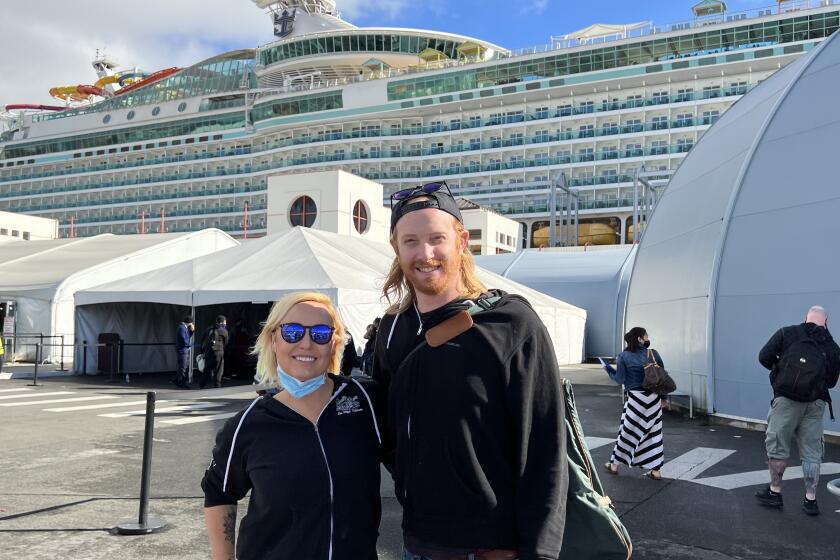 Jamie Robinson and Scott Bush outside the Royal Caribbean's Navigator of the Seas cruise ship