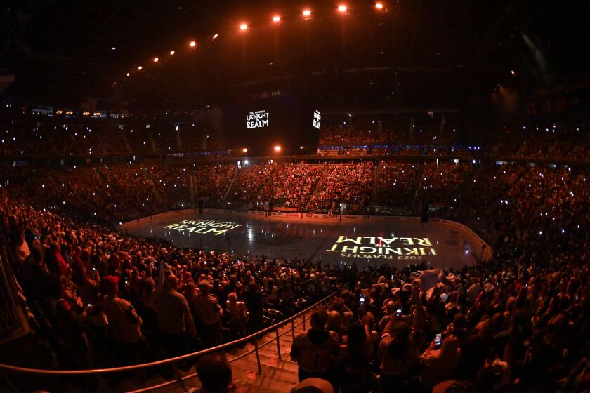 Spectators stand on their feet during the introduction of Game 5 of an NHL hockey Stanley Cup first-round playoff series between the Vegas Golden Knights and the Winnipeg Jets at T-Mobile Arena on Thursday, April 27, 2023, in Las Vegas. (AP Photo/David Becker)
