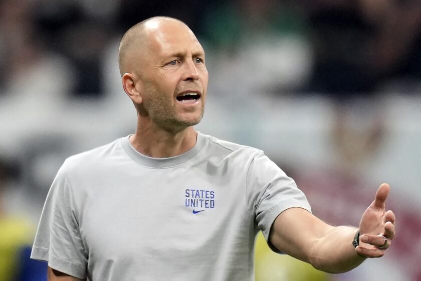 FILE - United States head coach Gregg Berhalter follows the game during the World Cup group B soccer match between England and The United States, at the Al Bayt Stadium in Al Khor, Qatar, Friday, Nov. 25, 2022. The U.S. Soccer Federation revealed Tuesday, Jan. 3, 2023 it is investigating that men's national team cach Gregg Berhalter said was a 1991 confrontation in which he kicked the woman who later became his wife.(AP Photo/Andre Penner, File)