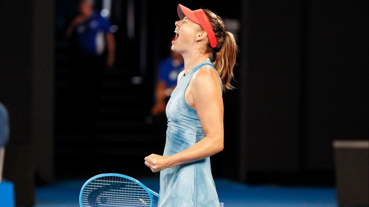 Russia's Maria Sharapova reacts after a point against Denmark's Caroline Wozniacki during their women's singles match on Day 5 of the Australian Open tennis tournament in Melbourne on January 18, 2019.