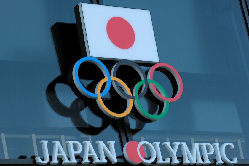 This picture shows the logo of the Japanese Olympic Committee displayed at an entrance of the Japan Olympic Museum in Tokyo on March 24, 2020. - The International Olympic Committee came under pressure to speed up its decision about postponing the Tokyo Games on March 24 as athletes criticised the four-week deadline and the United States joined calls to delay the competition. (Photo by Kazuhiro NOGI / AFP) (Photo by KAZUHIRO NOGI/AFP via Getty Images)